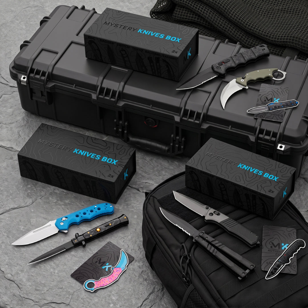 Three Mystery Knives Boxes with assorted folding knives, karambits and stickers on a black hard case and backpack